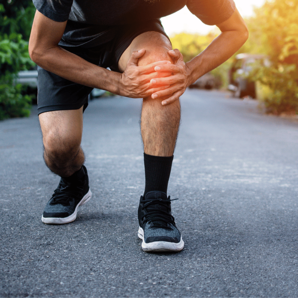 man holding sore knee
